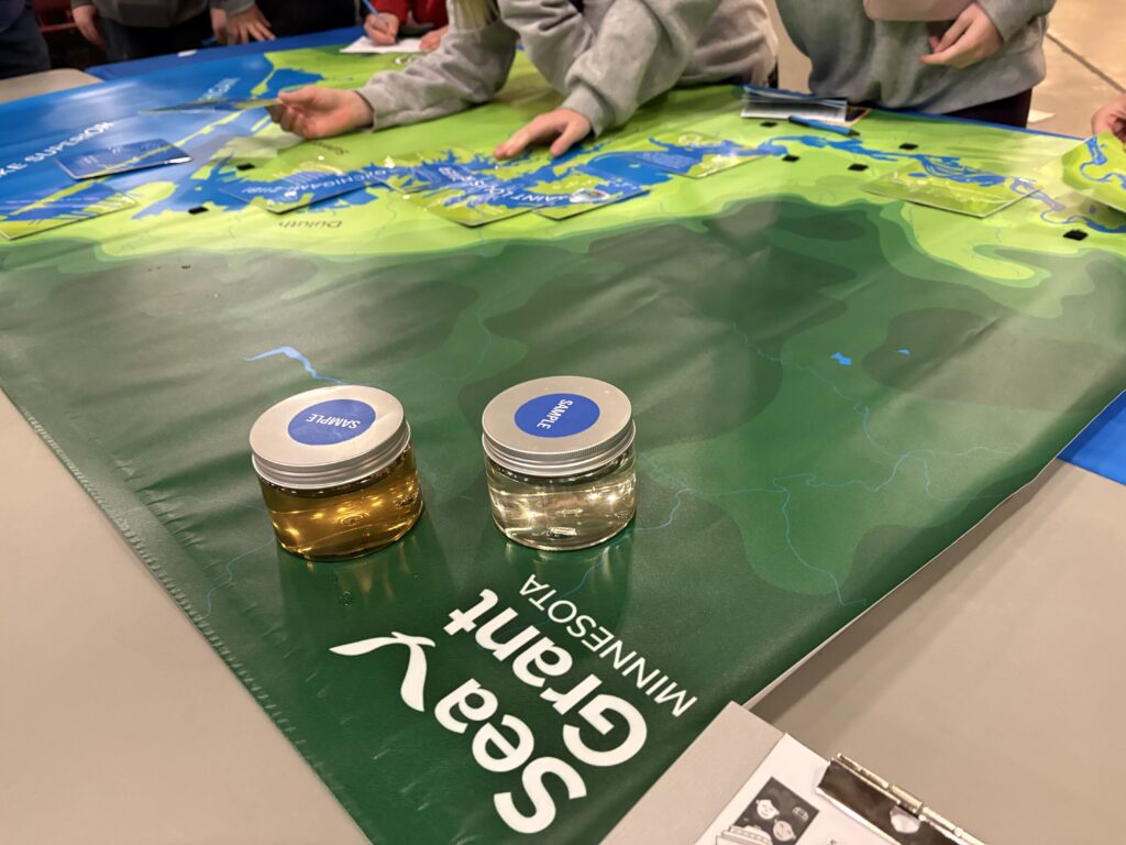 Close up image of map of St. Louis River system in Minnesota and jars of waters