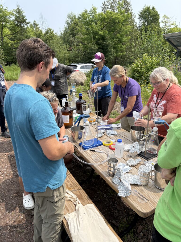 Educators and partners complete an outdoor lab activity.