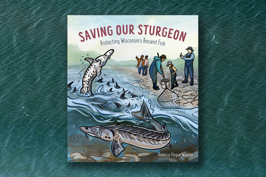 Book cover titled "Saving our sturgeon: Protecting Wisconsin's Ancient Fish" with an illustration of a sturgeon jumping out of the water and one underwater, with people standing on the shore